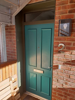 bespoke exterior timber door set, solid green with toplight