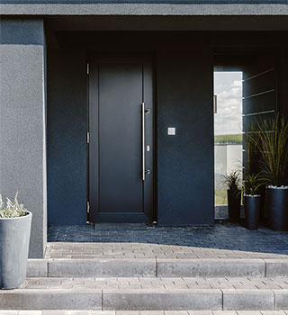bespoke black aluminium front door in a setting