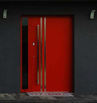 bespoke red aluminium front door with vertical steel strips