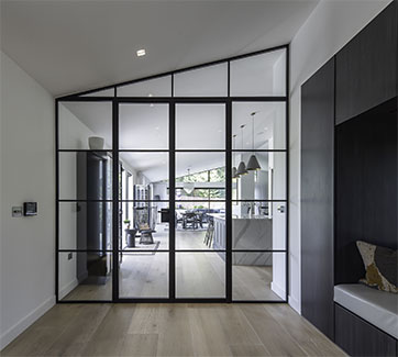 Steel room divider with angled top and french door